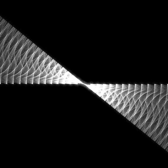 A black void splits open as two diagonal lines intersect. The new space reveals many sparkling, concentric waves of light.